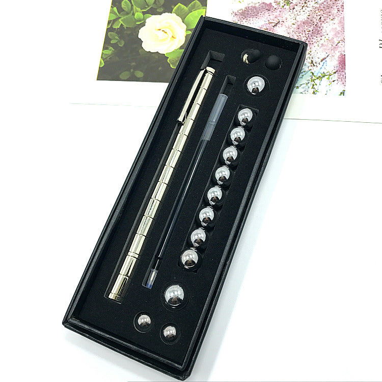 Magnetisk penna i silver med kulor