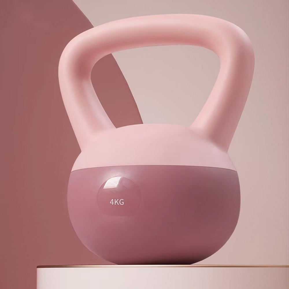 Ljusrosa mjuk kettlebell på golvet