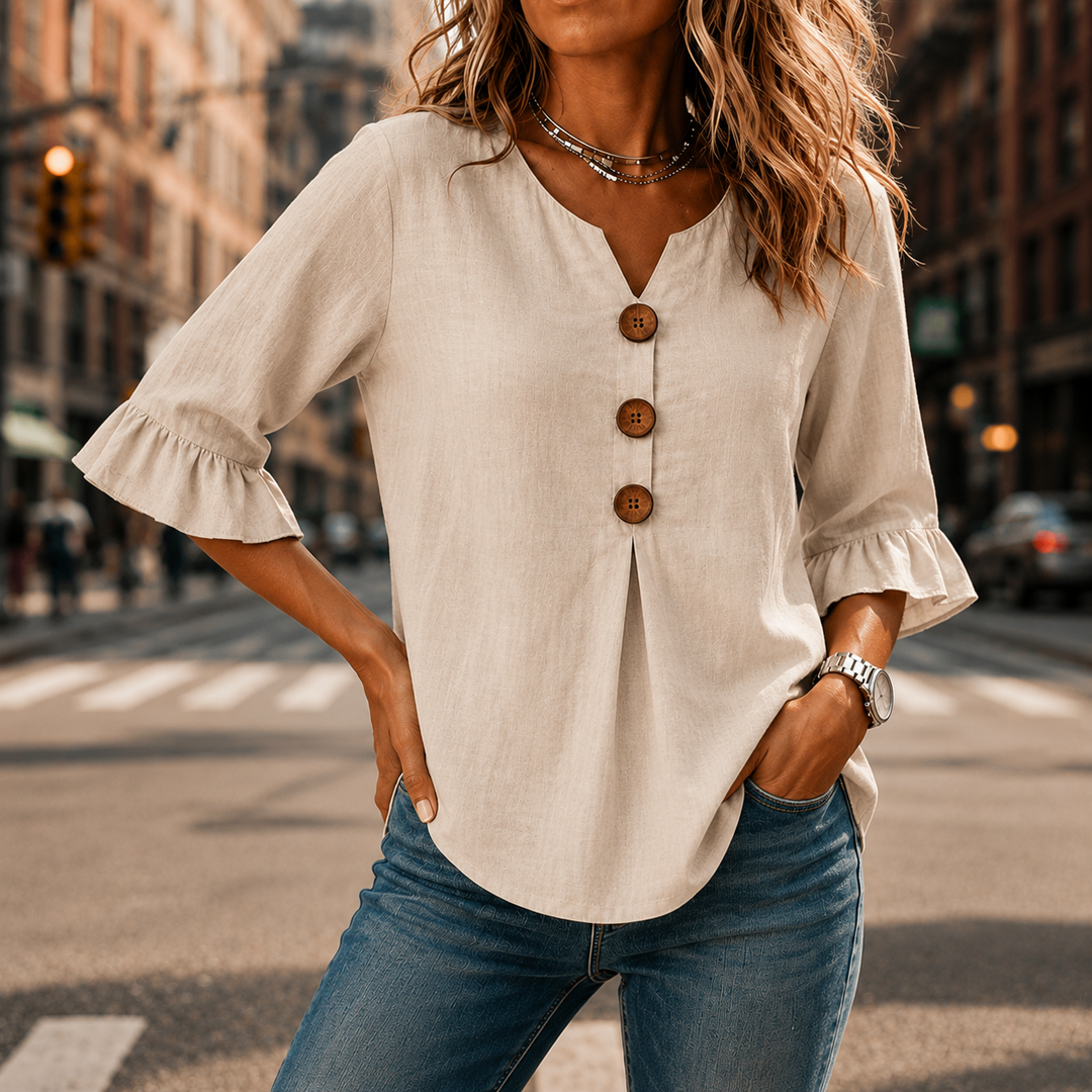 Laurelle – Blus z urringning w v-ringning i falbanami z knappar