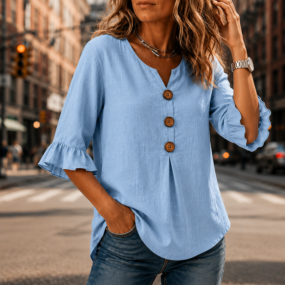 Laurelle – Blus z urringning w v-ringning i falbanami z knappar