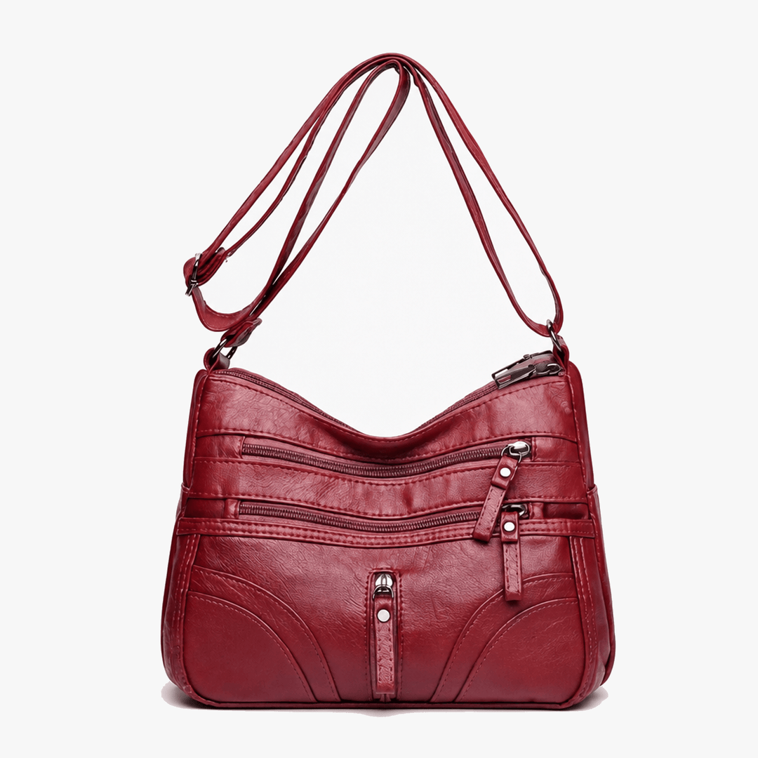 Caressa – Mjuk läder handväska crossbody med flera fickor